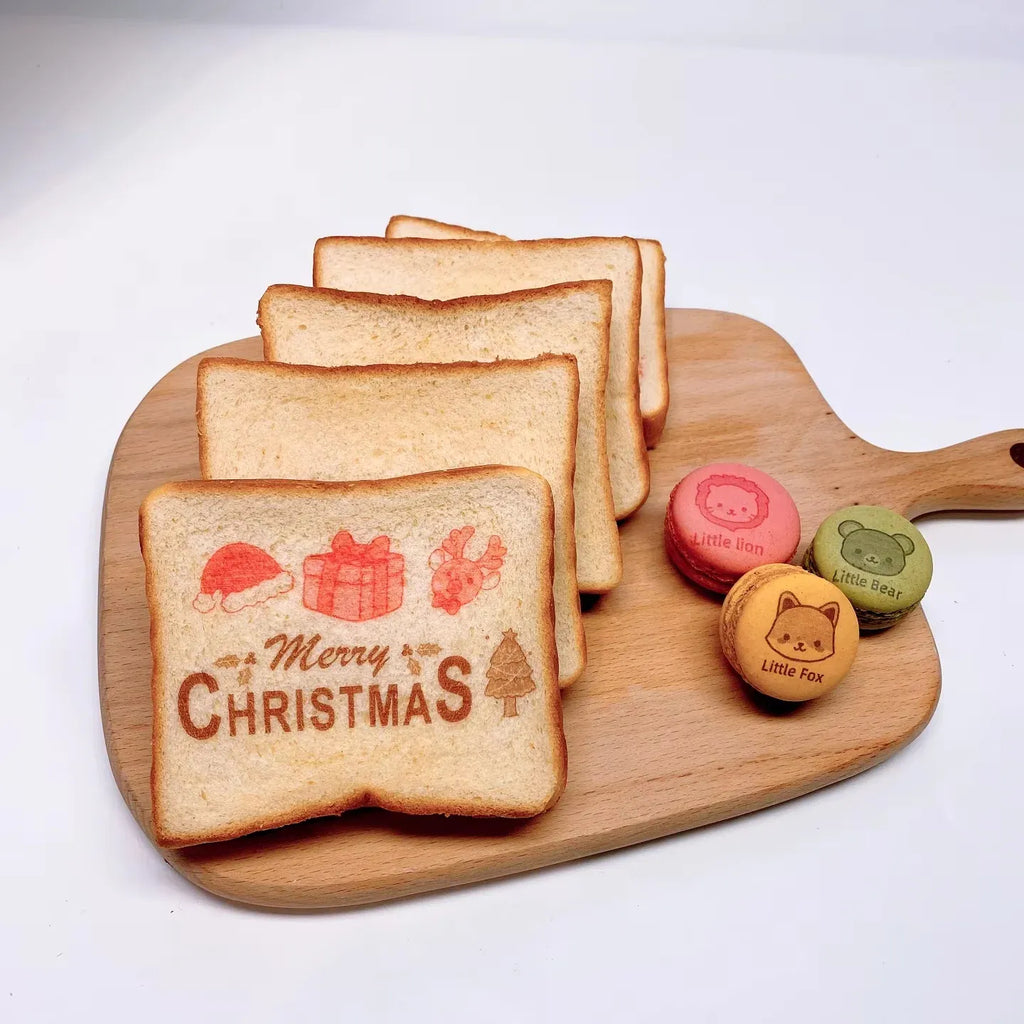 Wooden board with printed Christmas toast slices and small character cookie stamps