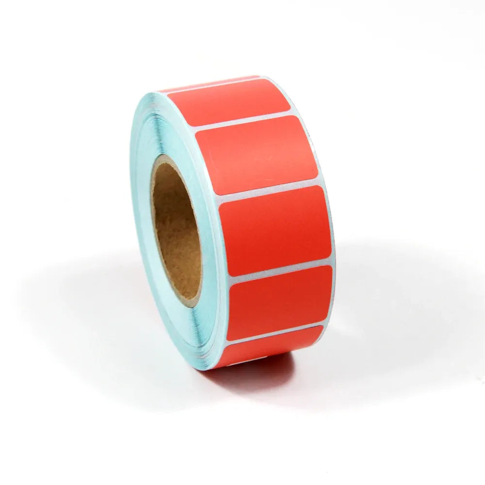 Light blue-backed adhesive label roll with red rectangular label squares
