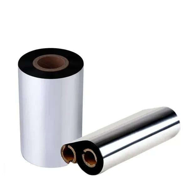 Barcode ribbon roll with black rim and brown core, plus two loose silver reels