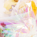 Iridescent holographic wrapping sheet with glossy rainbow stripes, close-up