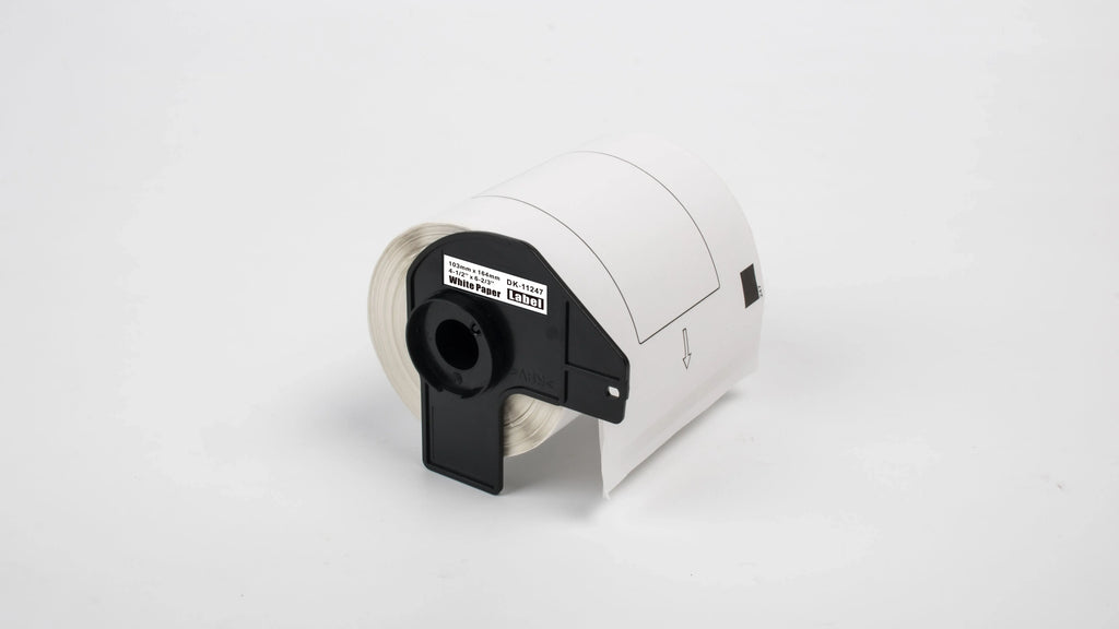 Thermal label roll close-up with black DK-11247 holder