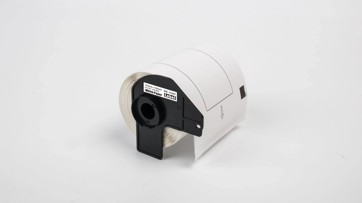 Thermal label roll close-up with black DK-11247 holder