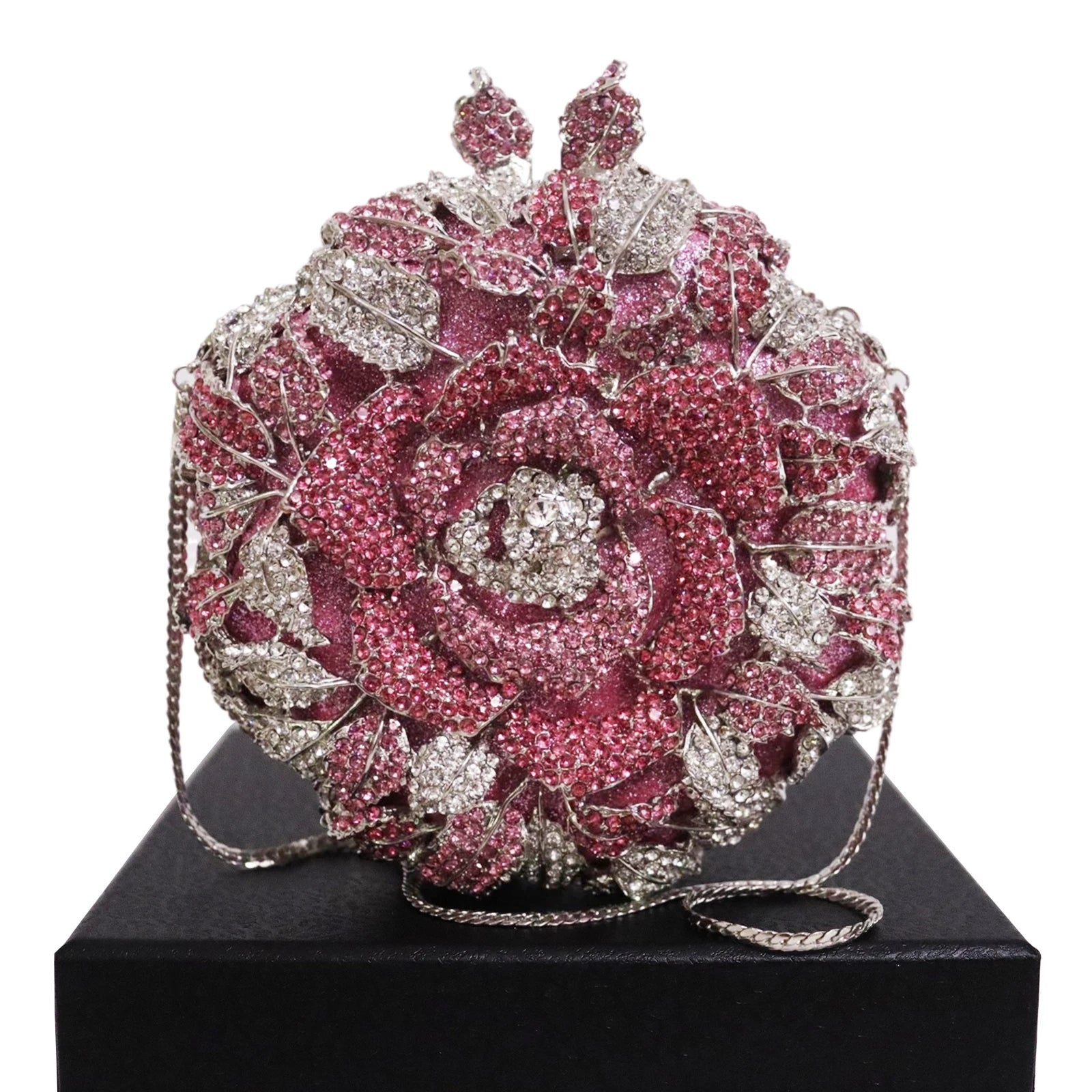 Luxury crystal-embellished rose clutch bag in pink and silver. Designer evening handbag for weddings and parties.