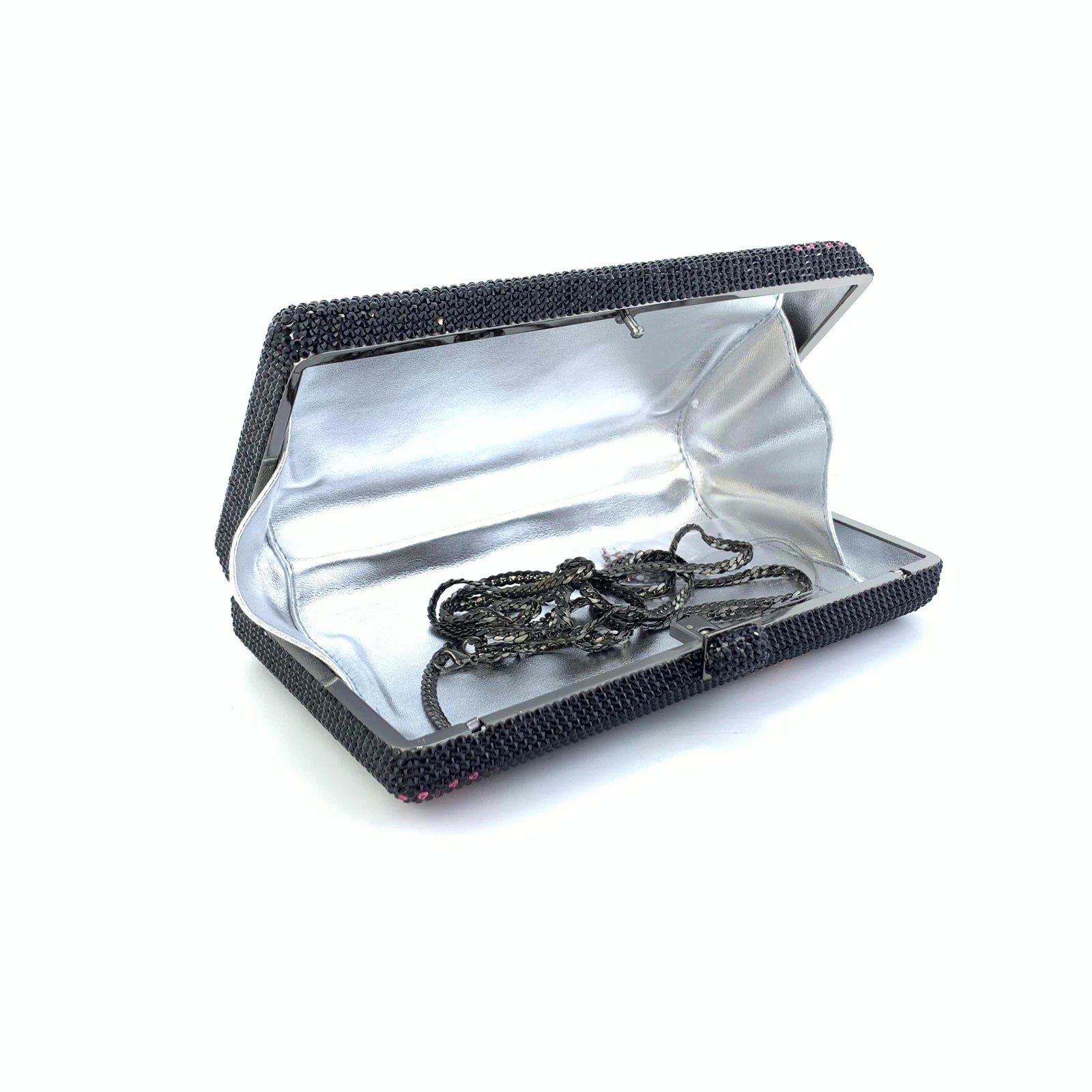 Black rhinestone Art Deco clutch purse with silver interior lining and detachable shoulder chain for evening wear.