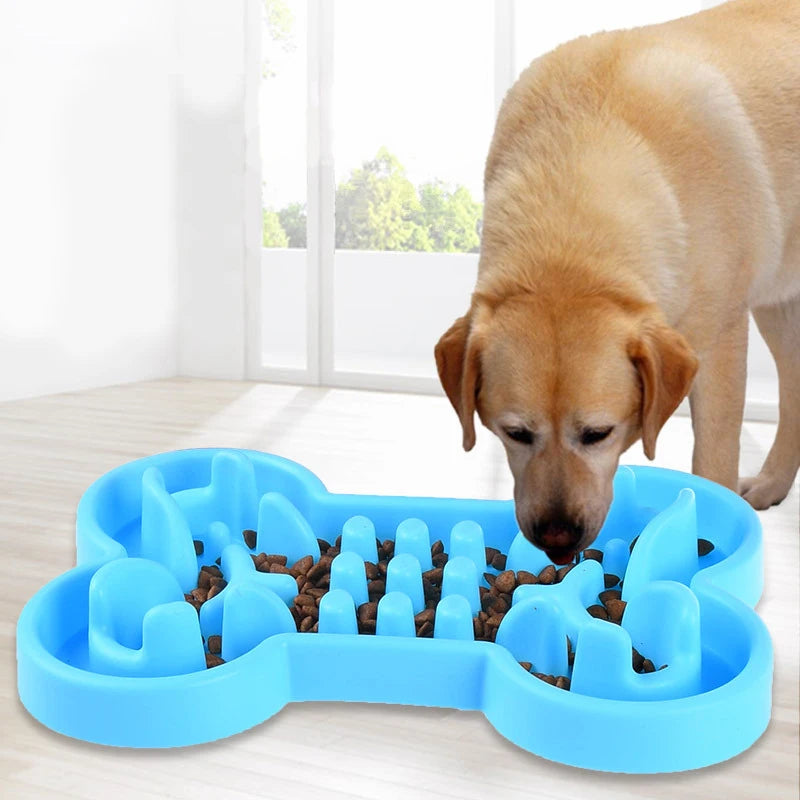 Blue soft rubber slow feeder dog bowl in bone shape. Anti-gulping travel bowl prevents choking for healthy pet eating.