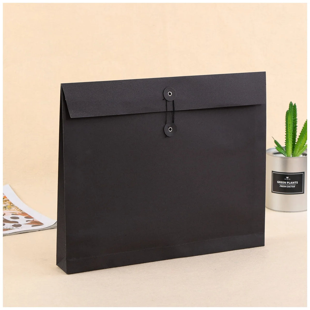 Black kraft paper clothing mailing pouch with snap-button closure, flat-bottom