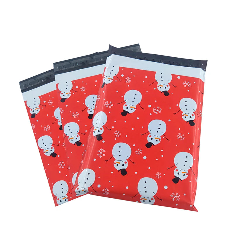 Set of red waterproof poly mailers stacked, snowman and snowflake print