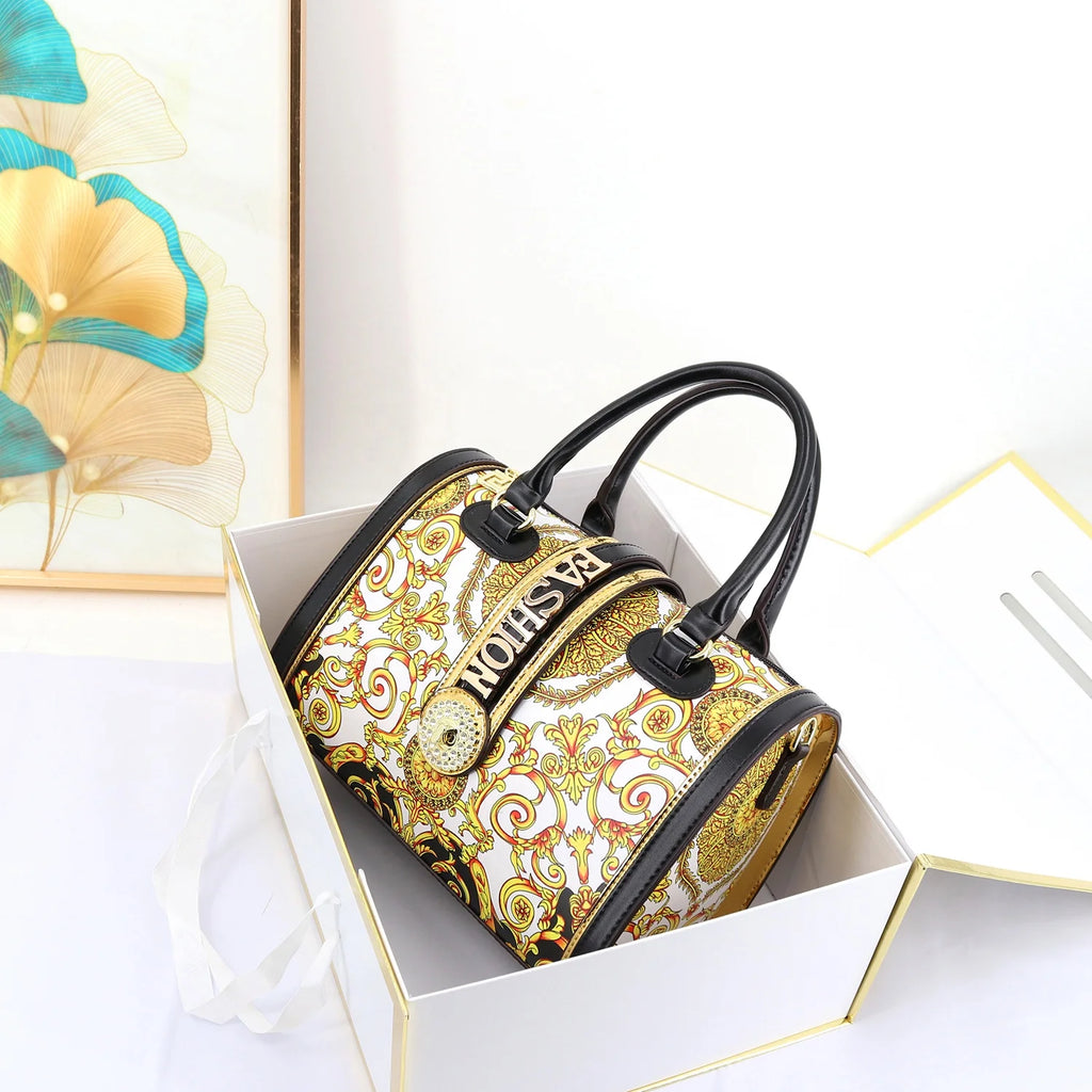 29cm designer trunk handbag featuring gold baroque print, black leather trim, and rhinestone-accented Fashion detail.