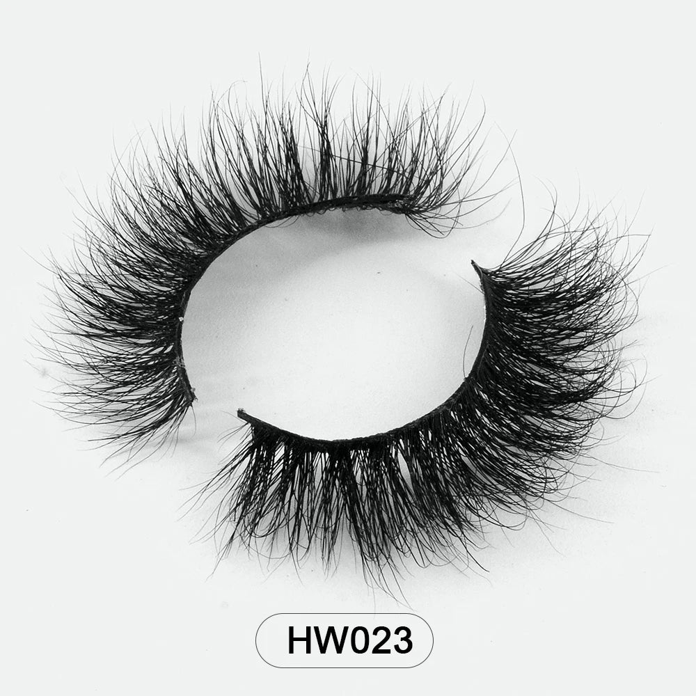Black 3D mink false eyelashes with a soft, curved band and voluminous, wispy layered fibers. Style labeled HW023.