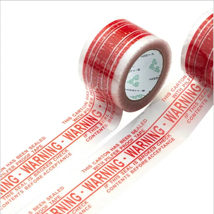 Red transparent warning tape rolls with repeating WARRANTY text