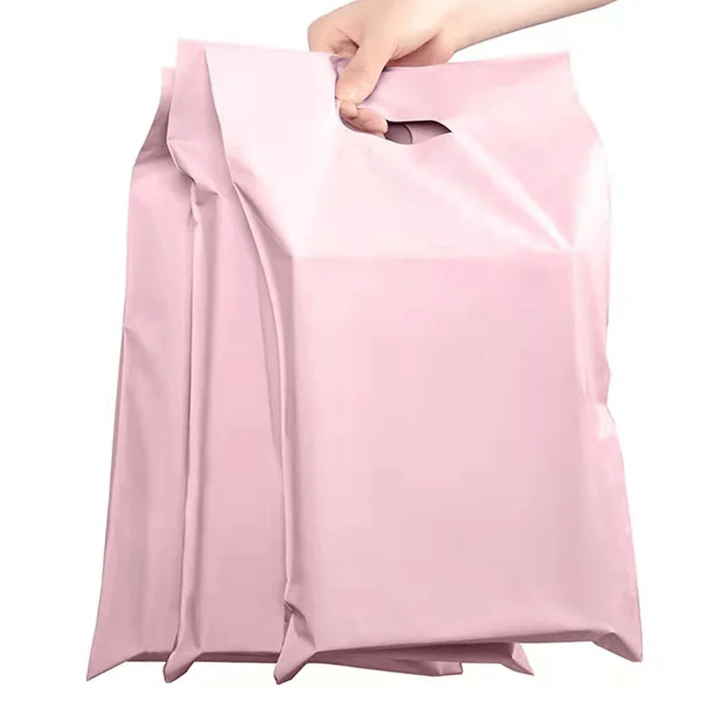 Pink poly mailing bag with carry handle opening and sealed top edge
