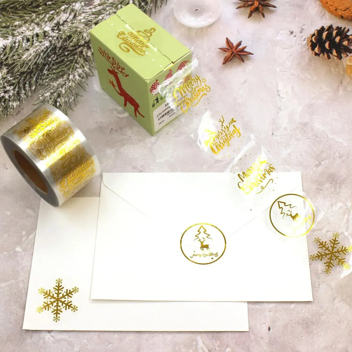 Self-adhesive round Christmas stickers with gold foil “Merry Christmas” and tree/snowflake designs.