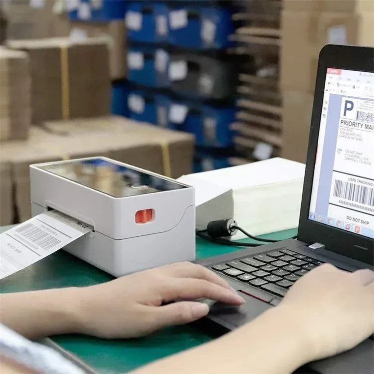 Thermal label printer in warehouse showing a shipping label being printed