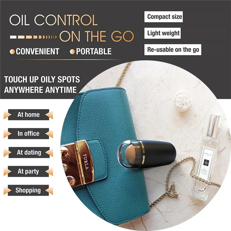 A portable black volcanic stone oil-absorbing roller tool next to a teal handbag and perfume bottle.