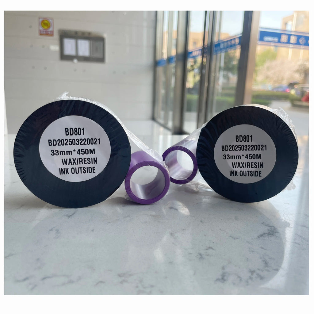 TTO ink coding ribbon spools with black cores and purple ribbon band, front labels