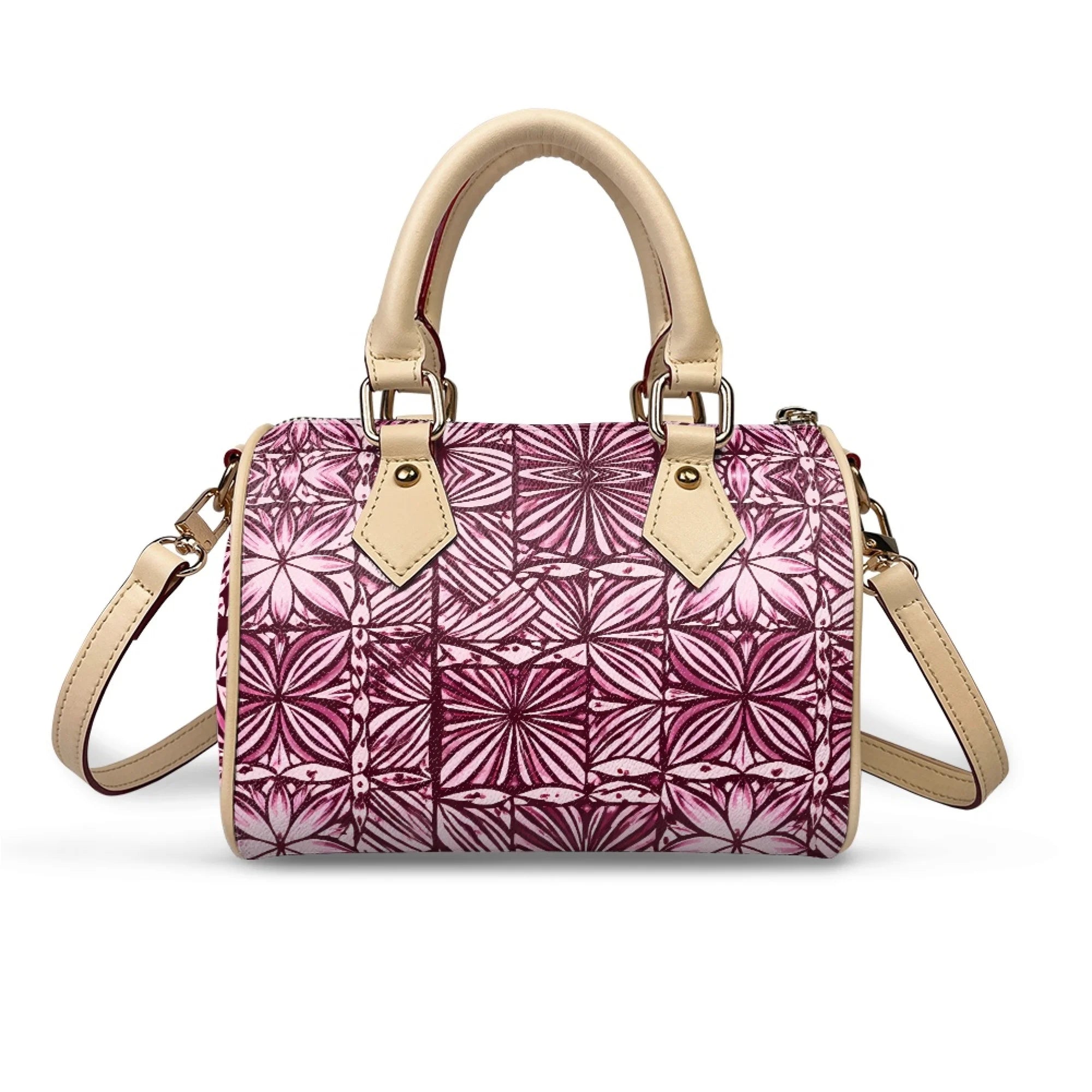 Pillow-shaped trunk handbag in pink tribal print with beige leather top handles, gold hardware, and shoulder strap.