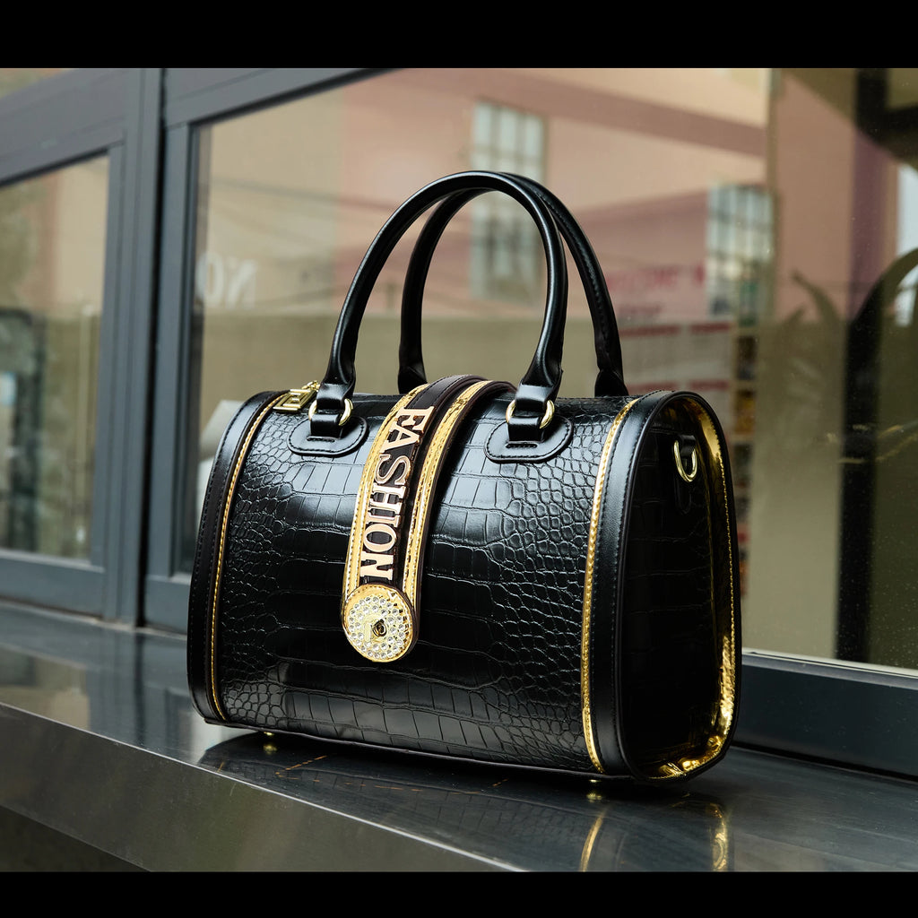Black faux crocodile trunk handbag, 29cm, with gold "FASHION" strap, rhinestone emblem, and sturdy top handles.