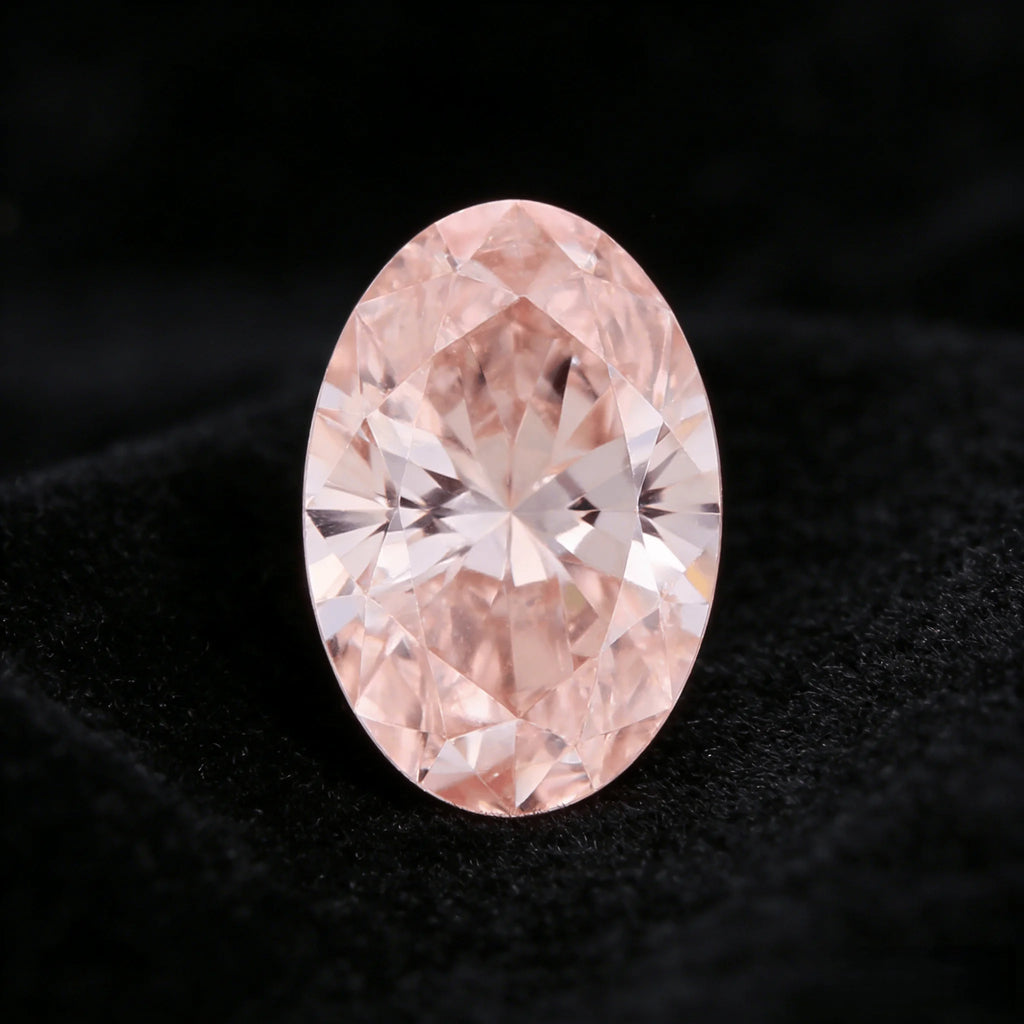 Oval fancy pink lab-grown diamond showing symmetrical facet star at center