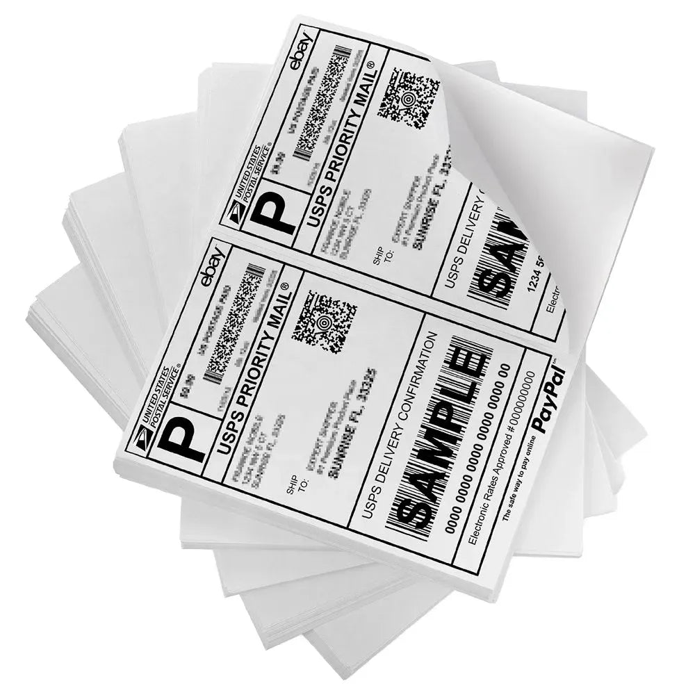 Stack of white direct thermal label stickers with barcodes and QR codes