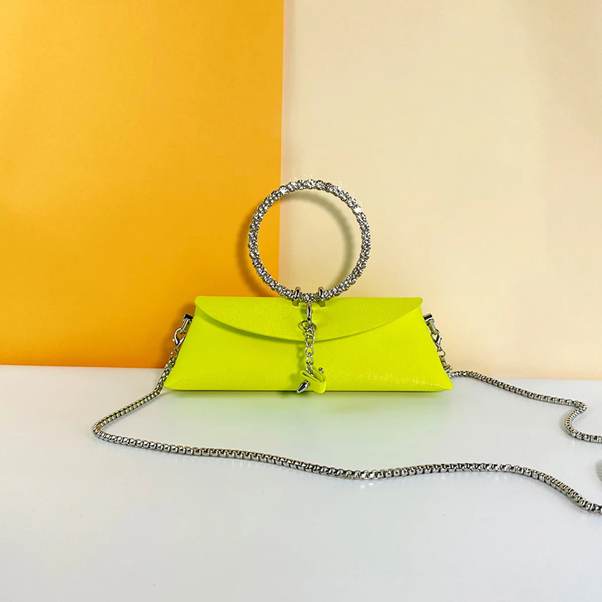 Neon yellow PU leather evening trunk clutch with rhinestone ring handle and silver chain strap for formal weddings.