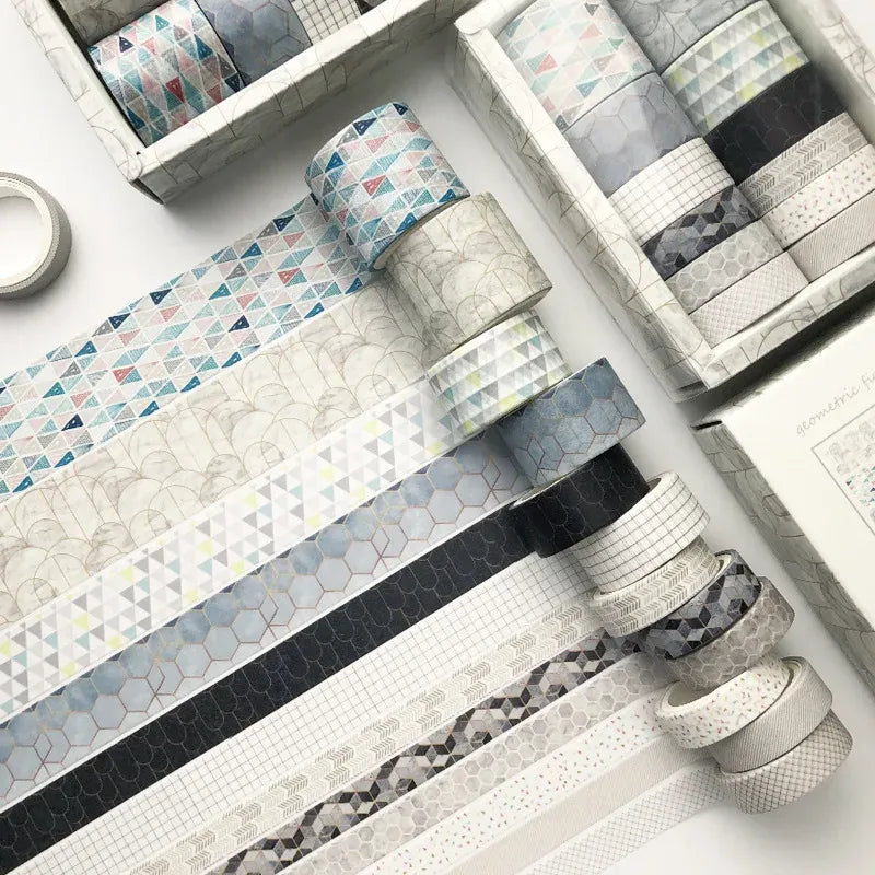 Washi tape set with white, gray, and dark navy geometric patterns and hexagon stripes