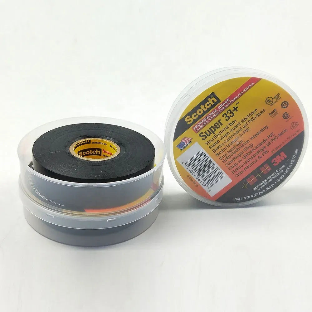 Black electrical tape rolls in plastic holder, Scotch Super 33+ labels visible