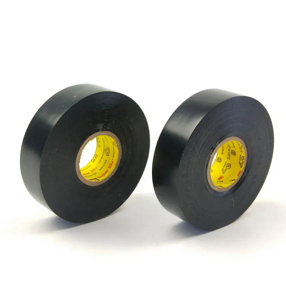 Two black electrical tape rolls with yellow inner cores