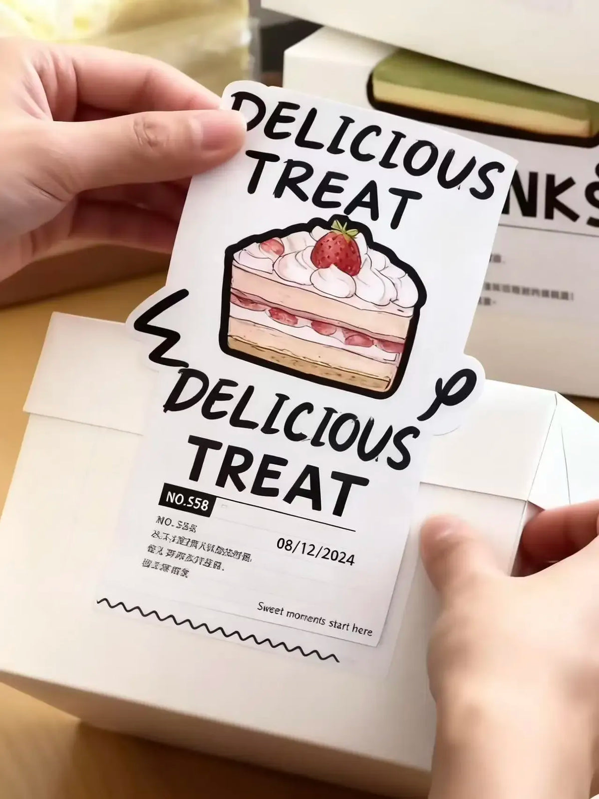 Delicious treat logo PVC sticker label on dessert box with hands