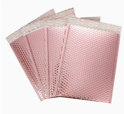 Rose pink metallic bubble mailer bags with crinkled padded surface