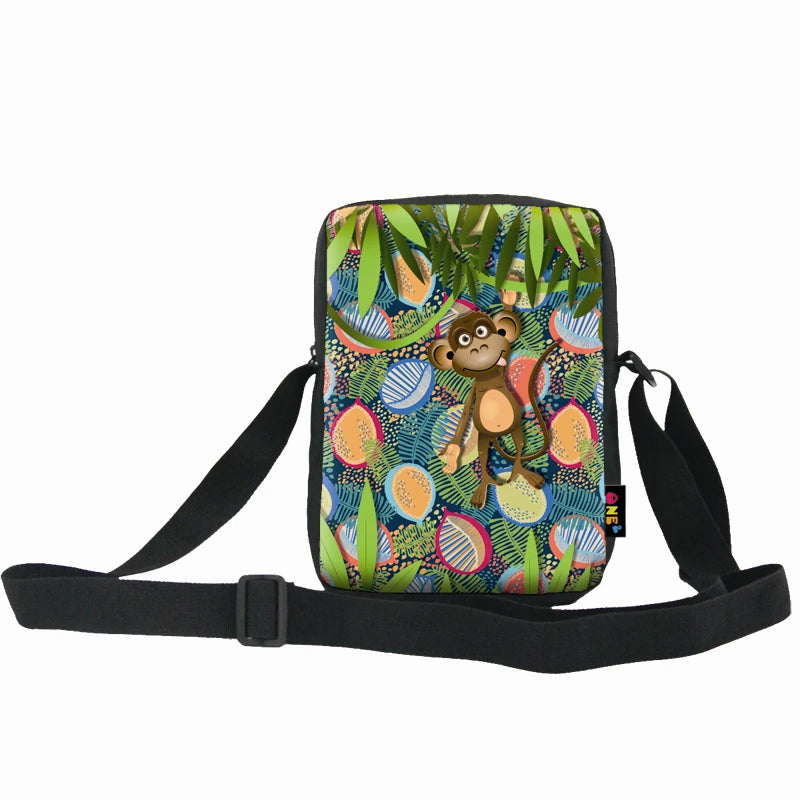 Messenger bag with monkey and jungle fruit print, black adjustable strap, durable material, casual crossbody style.