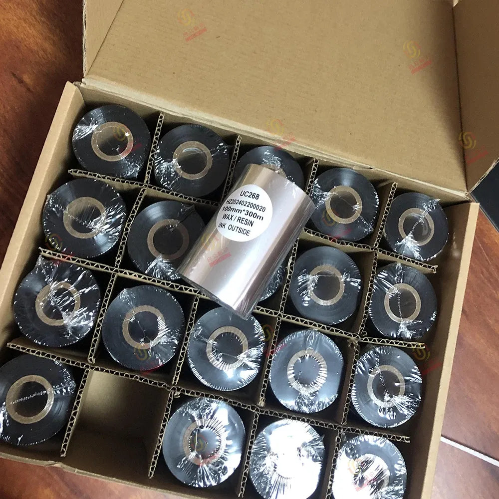 Cardboard tray filled with black resin wax barcode printer ribbon rolls