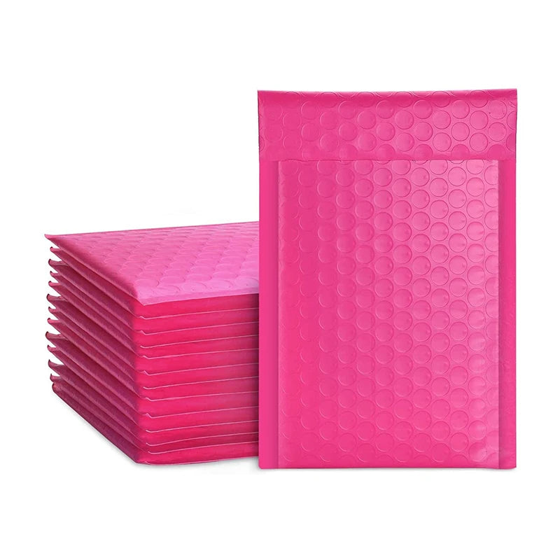 Hot pink bubble mailers, stacked waterproof padded shipping bags
