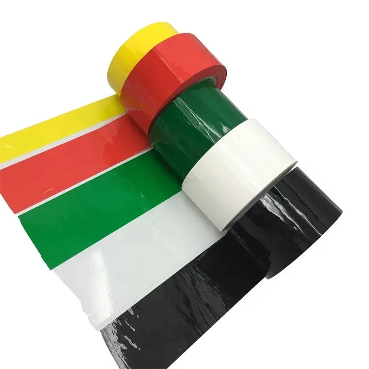Colored acrylic carton sealing tape rolls in yellow, red, green, white, and black