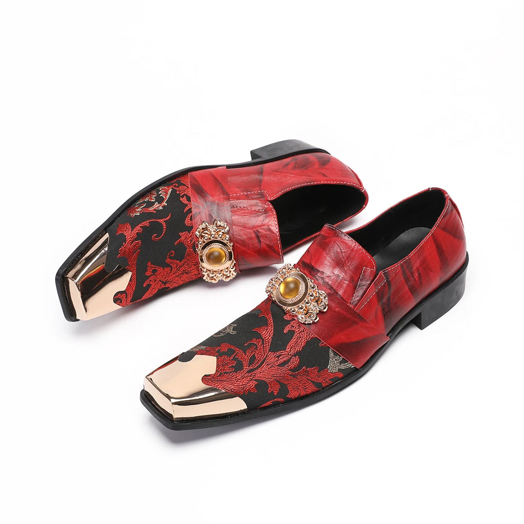 Red and black floral brocade luxury loafers with gold metal toe caps, ornate jewel hardware, and black leather soles.