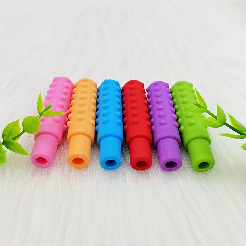 Multi-colored silicone baby teething toys for soothing sore gums and teeth.