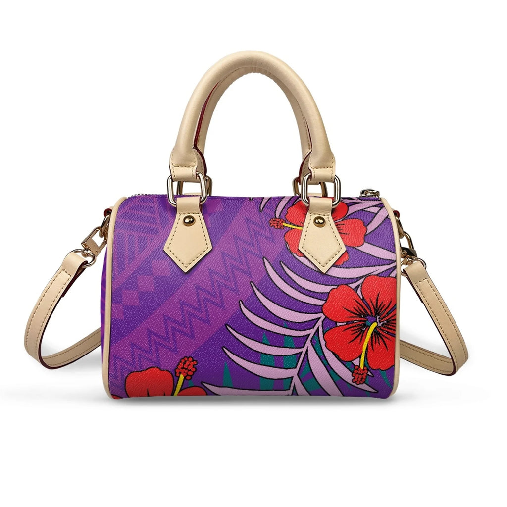Purple waterproof PU trunk bag with Samoan tribal patterns, red hibiscus flowers, and cream-colored handles and strap.