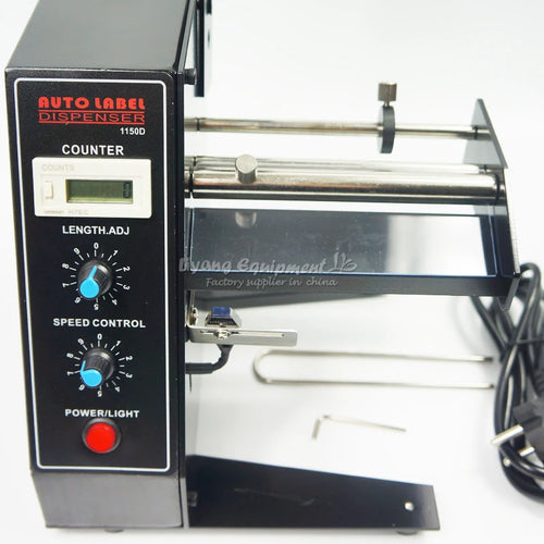 Electric label dispenser close-up showing counter screen and dispensing rollers