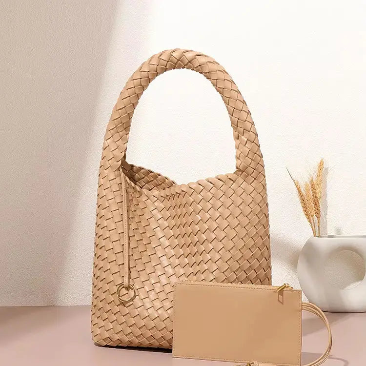 Beige woven PU leather bucket bag with a chic top handle and matching zip pouch for daily or beach use.