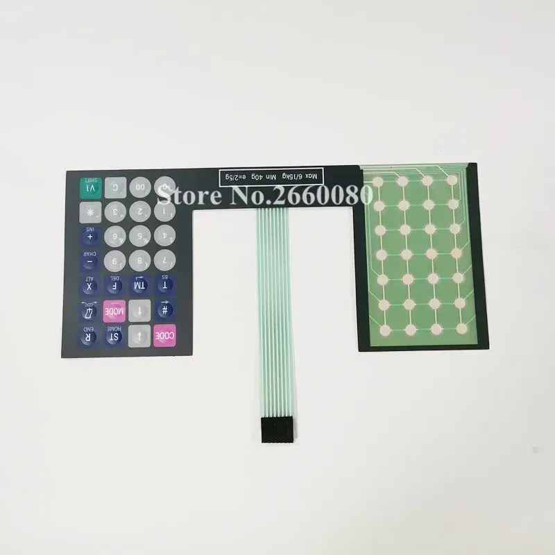 Keypad film strip with left numeric pad, center ribbon cable, and right dot-matrix grid