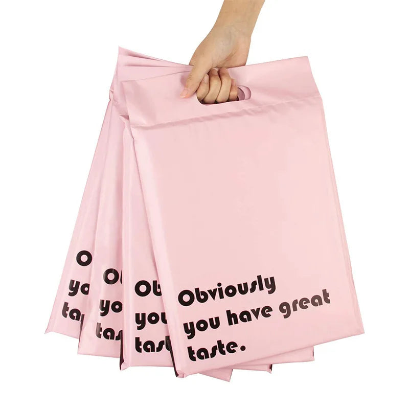 Pink custom printed poly mailing bag with handle, stacked with “Obviously you have great taste” text