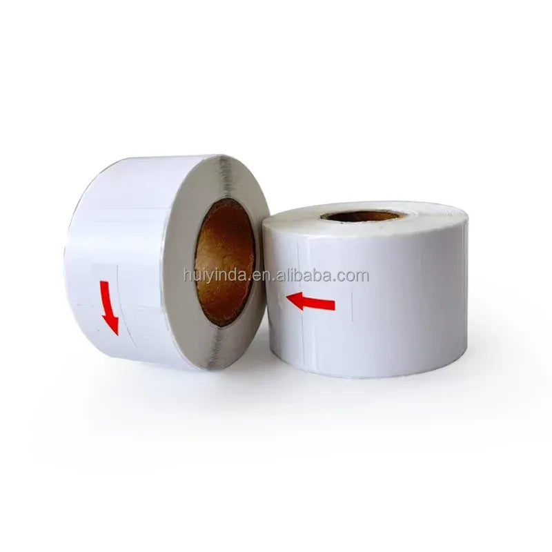 White thermal label rolls: one jumbo roll and one smaller roll side by side