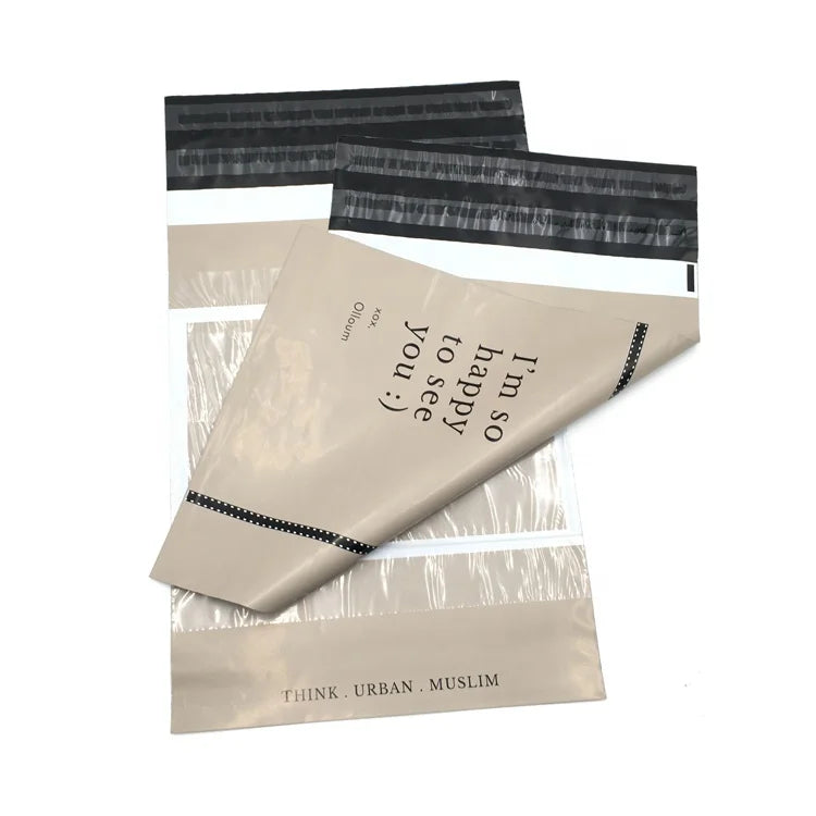 Cream plastic mailing envelopes with black seal strip and printed quote with circular accents