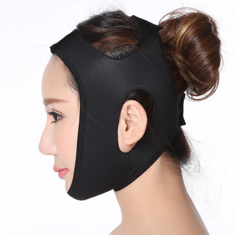 Woman wearing a black, elastic V-line face slimming bandage with ear cutouts against a white background.