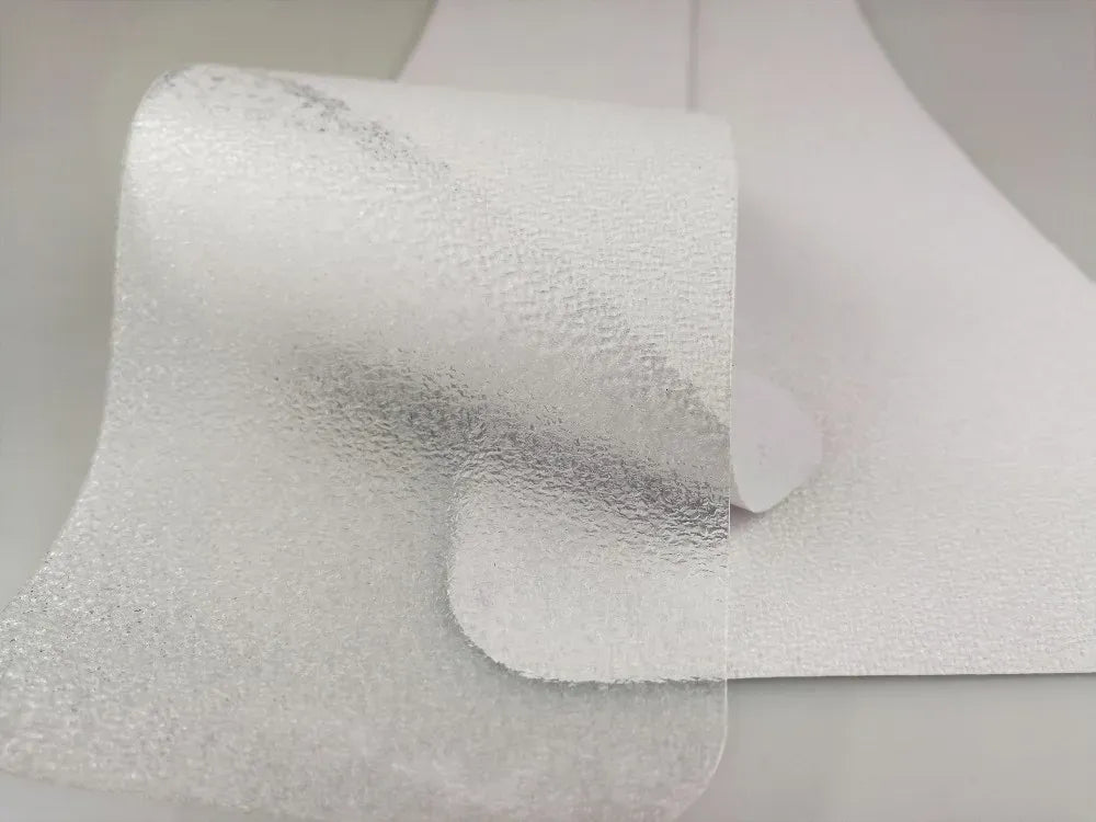 Clear anti-slip bathtub tape strip close-up with textured non-slip surface