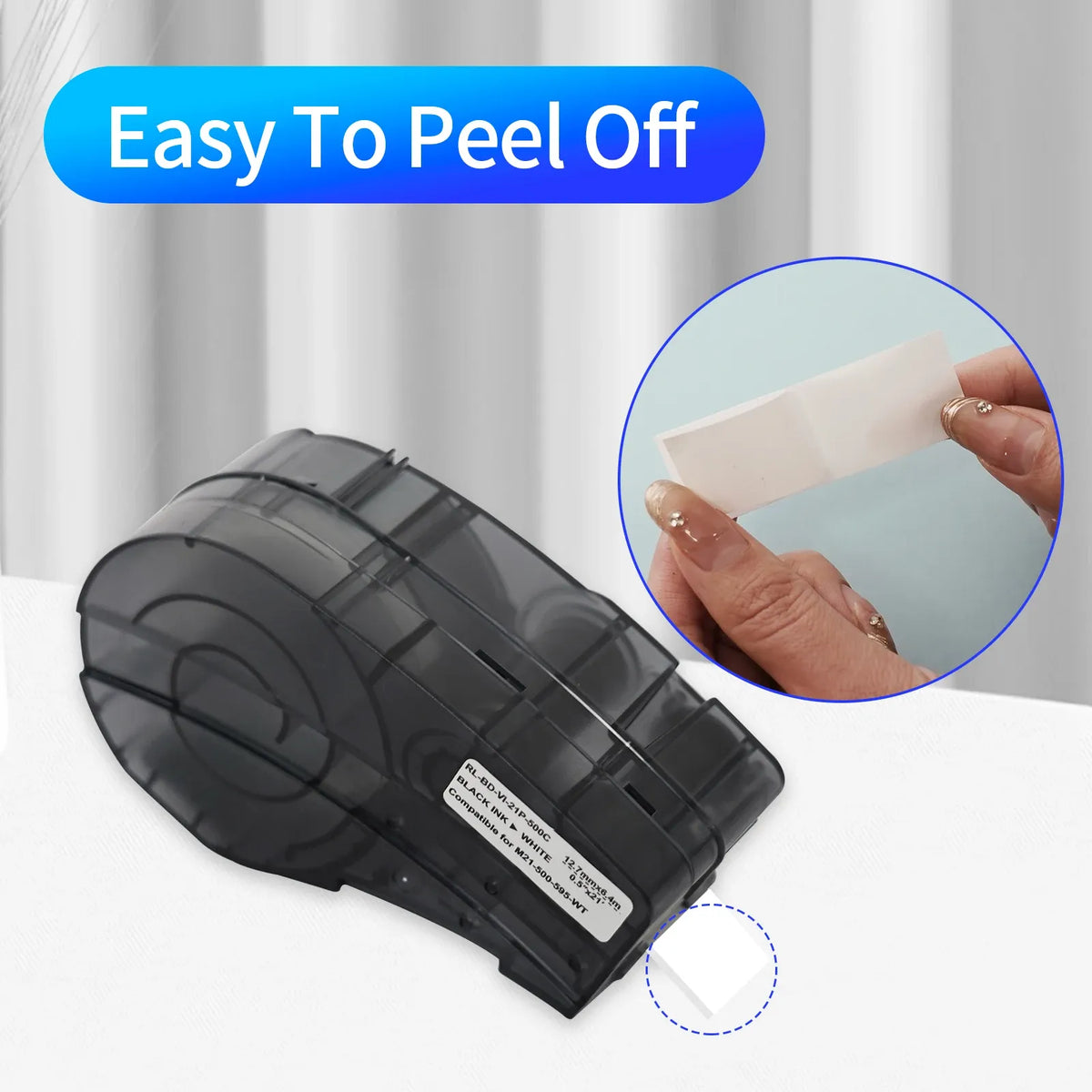 Black tape cartridge with white label backing being peeled by hand, label printer accessory