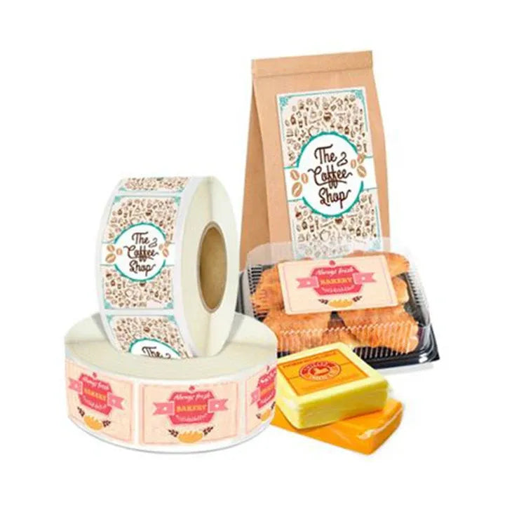Printed sticker label roll with coffee-themed designs and packaged snacks