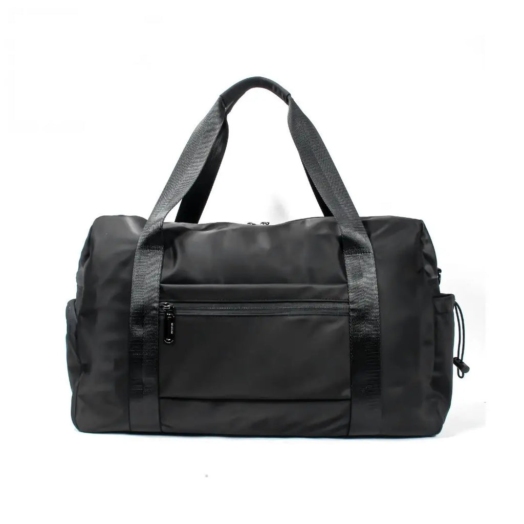 Black waterproof nylon travel duffel bag with zipper pockets, sturdy carry handles, and shoulder strap for trips.
