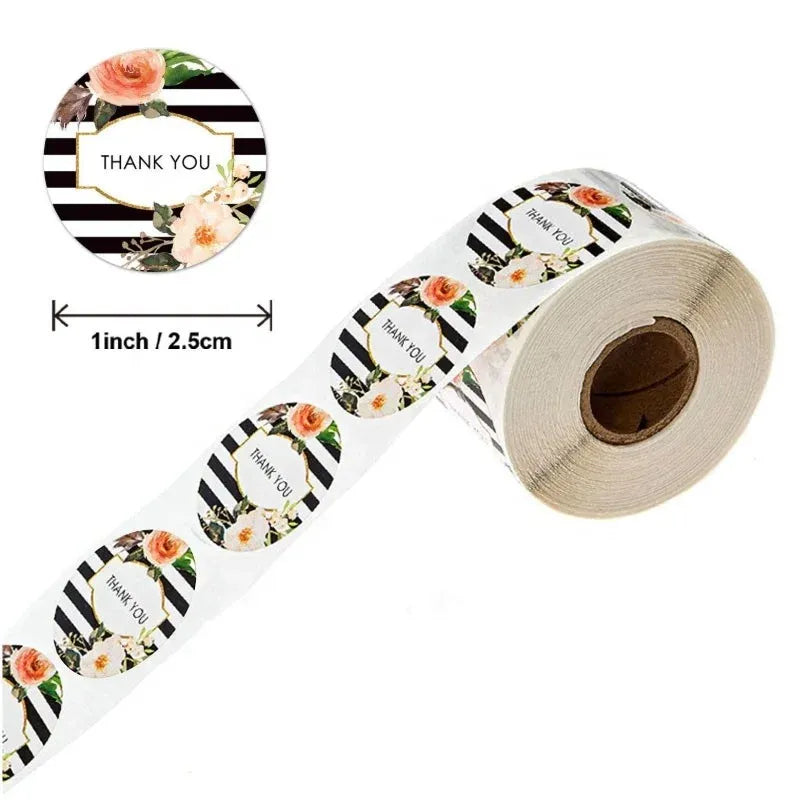 Strip and roll of round thank you stickers with roses and black-and-white stripes