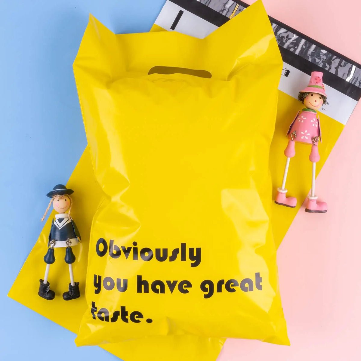 Yellow plastic mailing bag with handle cutout and “Obviously you have great taste.” text