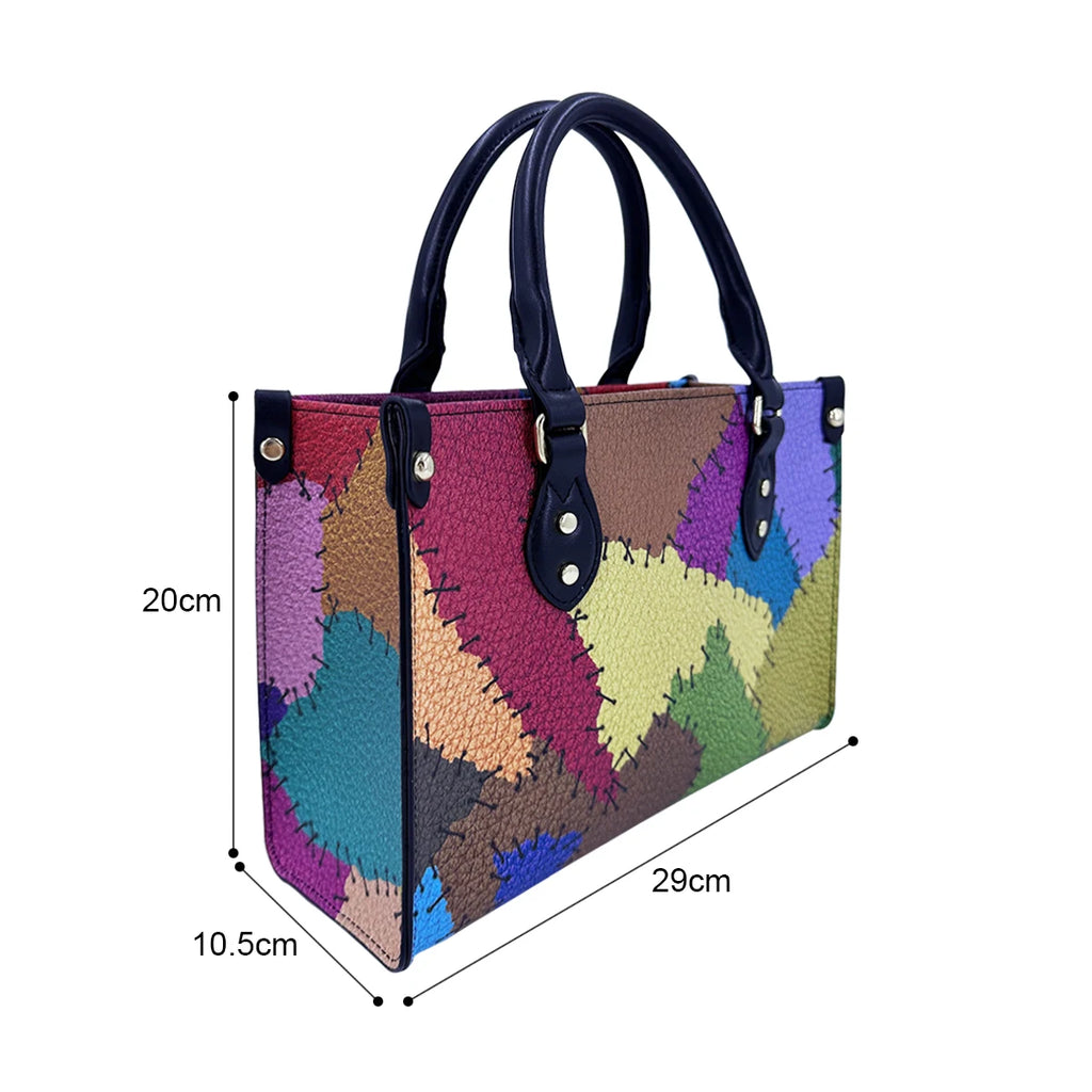 Multicolor patchwork PU leather trunk handbag with dark blue handles and stitched details, 29x20x10.5cm.